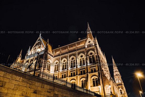 The Hungarian Parliament in Budapest on the Danube in the night lights of the street lamps. Стоковое фото, агентство Ingram Publishing / Фотобанк Лори