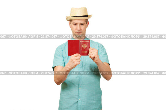 The man looks in the opened international passport. A look in a fullface. Стоковое фото, фотограф Владимир Арсентьев / Фотобанк Лори