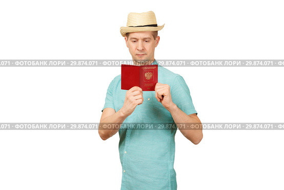 The man looks in the opened international passport. A look in a fullface. Стоковое фото, фотограф Владимир Арсентьев / Фотобанк Лори