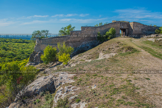 The remains of a medieval fortress city (according to other sources - a monastery) Tepe-Kermen, covering the upper part of the mountain in several tiers (2020 год). Стоковое фото, фотограф Анна Кривицкая / Фотобанк Лори
