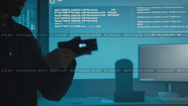 The tension rises as two programmers focus intently on their screens, working through complex code in a dark office environment. Стоковое AI-видео, аниматор Данила Большаков / Фотобанк Лори