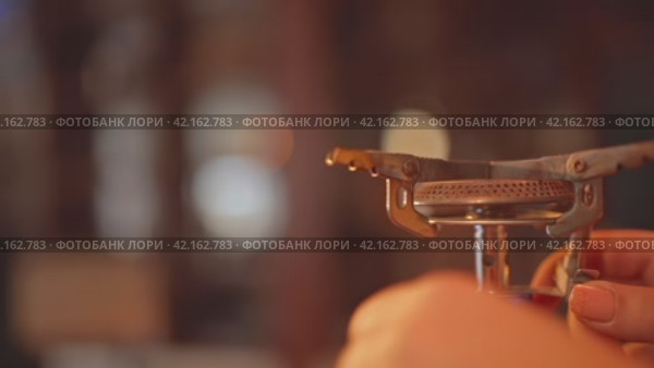 The woman hands light a gas burner, a blue flame igniting. Igniting Gas Burner with Blue Flame. Стоковое видео, видеограф Даниил Хабаров / Фотобанк Лори