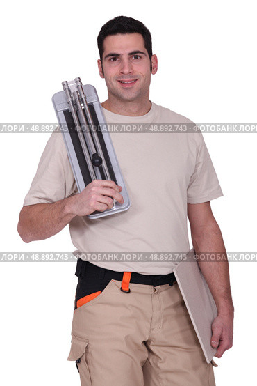 Tiler to tile cutting machine. Стоковое фото, агентство Ingram Publishing / Фотобанк Лори