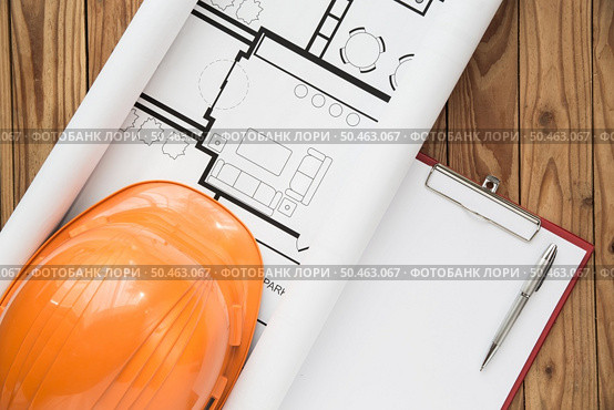 Top view engineer plan on wood background. Стоковое фото, агентство Ingram Publishing / Фотобанк Лори