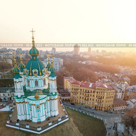 Top view on the Kiev Podil and of St. Andrew’s Church. City landscape of the Ukrainian historical center - the capital of Ukraine. Drone photo. Andrew’s Church on Andrew Descent in Kiev. Стоковое фото, агентство Ingram Publishing / Фотобанк Лори