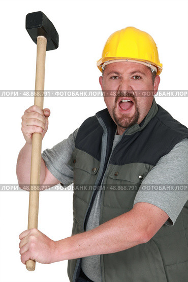 Tradesman holding a mallet. Стоковое фото, агентство Ingram Publishing / Фотобанк Лори