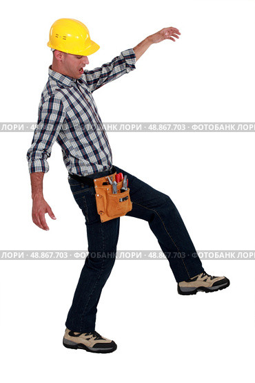 Tradesman walking across a tightrope. Стоковое фото, агентство Ingram Publishing / Фотобанк Лори