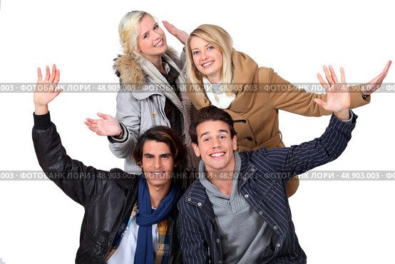 Two couples in winter clothing. Стоковое фото, агентство Ingram Publishing / Фотобанк Лори