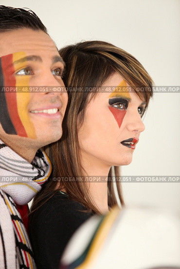 Two engrossed German football fans. Стоковое фото, агентство Ingram Publishing / Фотобанк Лори