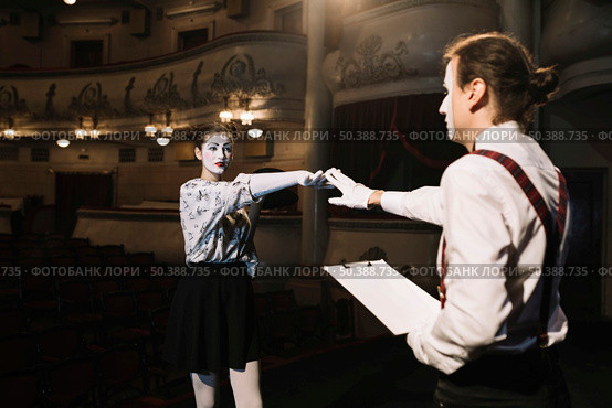 two male female mime artist rehearsing stage auditorium. Стоковое фото, агентство Ingram Publishing / Фотобанк Лори
