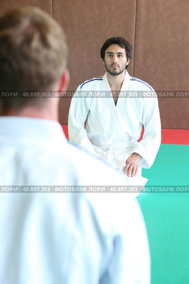 two men in kimono facing each other. Стоковое фото, агентство Ingram Publishing / Фотобанк Лори