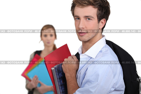 Two students carrying schoolwork. Стоковое фото, агентство Ingram Publishing / Фотобанк Лори