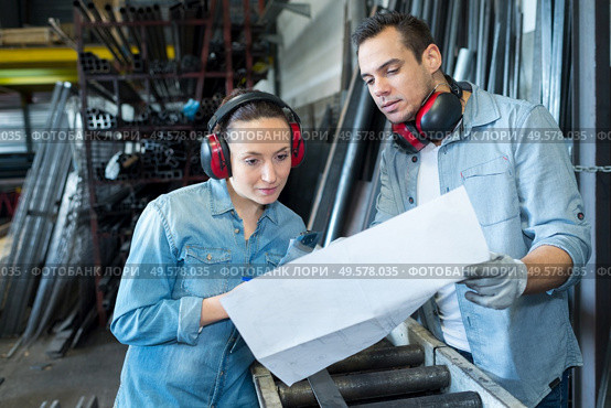 two worker in factory on the machine. Стоковое фото, агентство Ingram Publishing / Фотобанк Лори