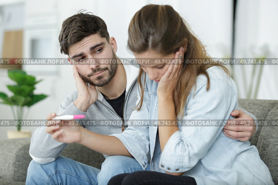 upset couple lover upset about the pregnancy test. Стоковое фото, агентство Ingram Publishing / Фотобанк Лори