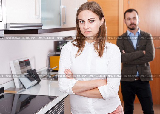Upset girl with husband in kitchen furniture salon. Стоковое фото, фотограф Яков Филимонов / Фотобанк Лори