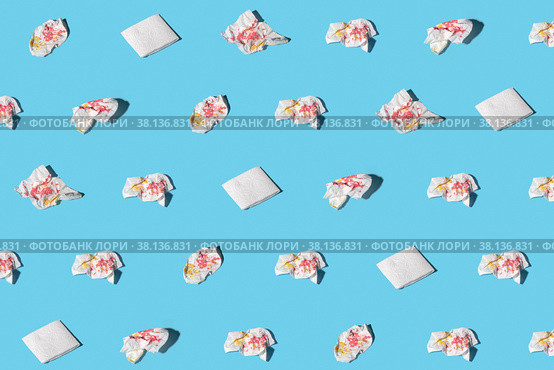Used and clean napkins on blue background. Concept of exclusiveness, uniqueness. Trendy isometric pattern with soft shadow. Стоковое фото, фотограф Эдуард Слободянюк / Фотобанк Лори