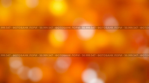 Vibrant blurred autumn background with red, orange and yellow colors, an abstract impressionistic landscape for seasonal or creative design. Стоковое фото, фотограф Павел Муравьев / Фотобанк Лори