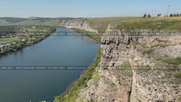 Video of beautiful summer landscape with White Rocks along bank of Siberian Belaya River near village of Kholmushino, Usolye-Sibirskoye district. Top view of natural landmark. Стоковое видео, видеограф Виктория Катьянова / Фотобанк Лори