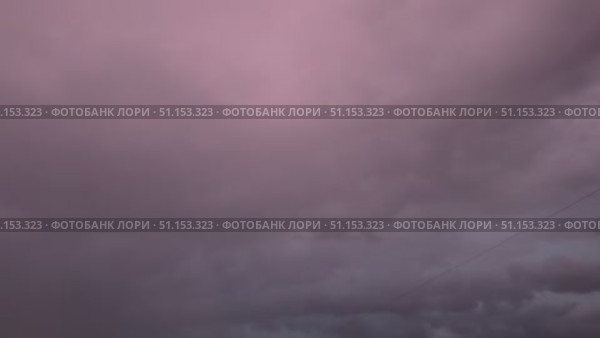Video of sky with black thunderclouds and bright flashes during thunderstorm and shower in summer. Natural sky background. Weather forecast. Natural phenomena. Bad weather. Стоковое видео, видеограф Виктория Катьянова / Фотобанк Лори
