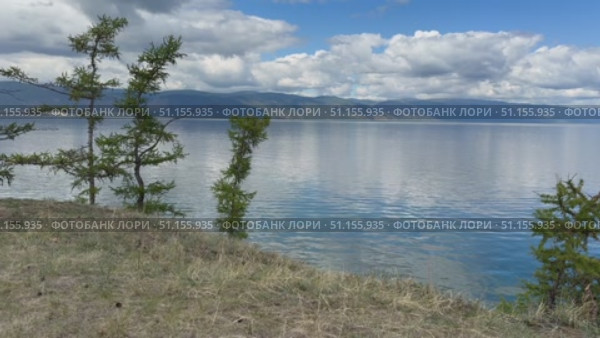 Video of summer landscape of Baikal Lake on sunny August day. View of Small Sea from Olkhon island coast. Natural background. Summer travels and outdoor recreation. Стоковое видео, видеограф Виктория Катьянова / Фотобанк Лори