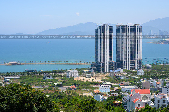 View from the mountain to the city of Nha Trang, Vietnam, with skyscrapers on the shore of the Gulf of the South China Sea. Стоковое фото, фотограф Сергей Фролов / Фотобанк Лори