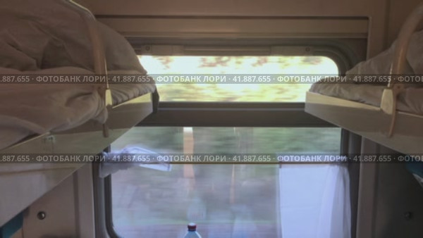 View from the window of the compartment car while driving. The concept of traveling by rail. Стоковое видео, видеограф Ярославский Максим / Фотобанк Лори