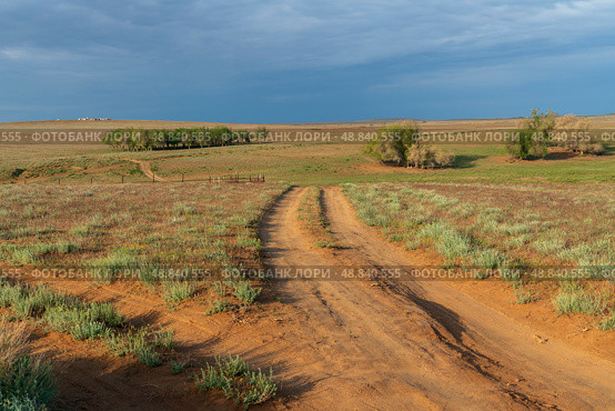View of semi-desert landscapes opening from the foot of the tourist center "Sarai-Batu" on a sunny summer day, Kharabalinsky district, Astrakhan region, Russia. Стоковое фото, фотограф Ula Ulachka / Фотобанк Лори