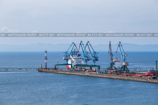 View of the pier of the Korsakov Sea Trade Port on Sakhalin Island. (2019 год). Редакционное фото, фотограф Ирина Кононова / Фотобанк Лори