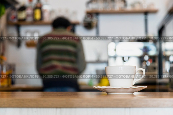 white coffee cup saucer coffee counter. Стоковое фото, агентство Ingram Publishing / Фотобанк Лори