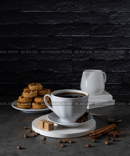 White cup with black coffee stands on a light tray. Стоковое фото, фотограф Анна Никитина / Фотобанк Лори
