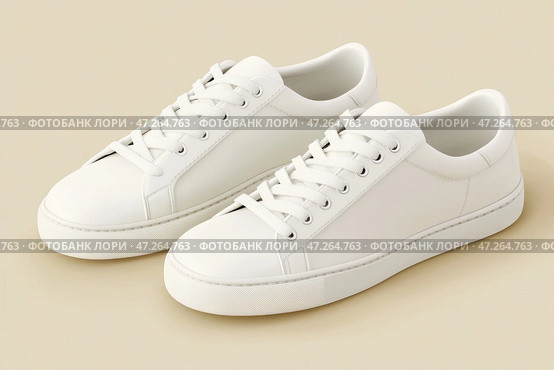 White leather lace-up running shoes with low tops, thick soles on a beige. The laces and rubber outsole. Sporty look. Men to wear during outdoor activities. Street hiking shoes. Trendy Male Boots Pair. Стоковое AI-изображение, AI-художник Марина Демидюк / Фотобанк Лори