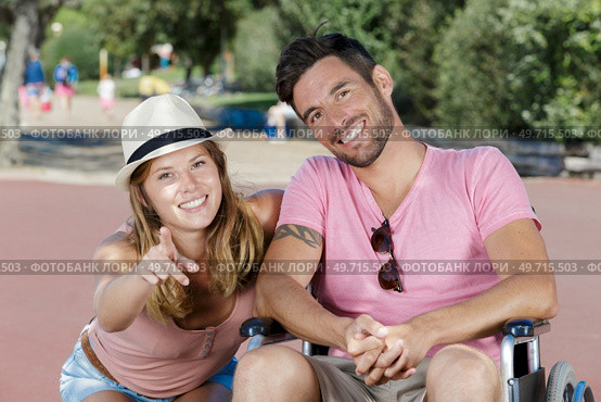 woman and disabled man in the park. Стоковое фото, агентство Ingram Publishing / Фотобанк Лори