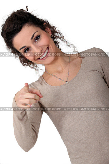 Woman giggling and pointing. Стоковое фото, фотограф Phovoir Images / Фотобанк Лори