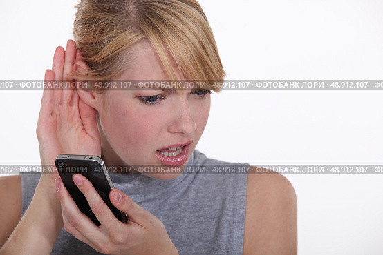 Woman having troubles hearing. Стоковое фото, агентство Ingram Publishing / Фотобанк Лори