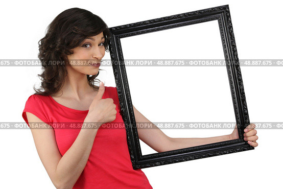 Woman holding a picture frame. Стоковое фото, агентство Ingram Publishing / Фотобанк Лори