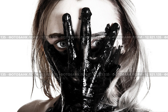 Woman holding a tarred hand on her face. Стоковое фото, фотограф Art Konovalov / Фотобанк Лори
