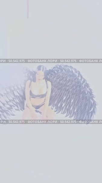 Woman poses with intricate wings in a studio setting for a beauty shoot. Стоковое видео, видеограф Гурьянов Андрей / Фотобанк Лори