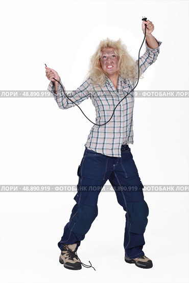 Woman receiving electric shock. Стоковое фото, агентство Ingram Publishing / Фотобанк Лори