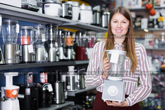 woman shows functional blender. Стоковое фото, фотограф Яков Филимонов / Фотобанк Лори