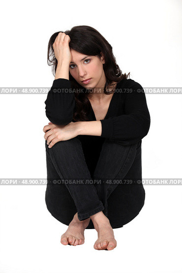 Woman sitting pensively. Стоковое фото, агентство Ingram Publishing / Фотобанк Лори