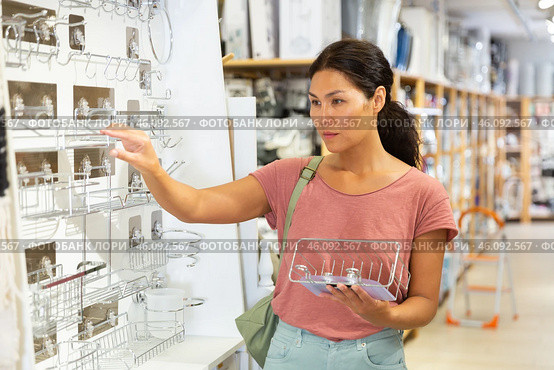 Woman standing and choosing metal soap dish. Стоковое фото, фотограф Яков Филимонов / Фотобанк Лори