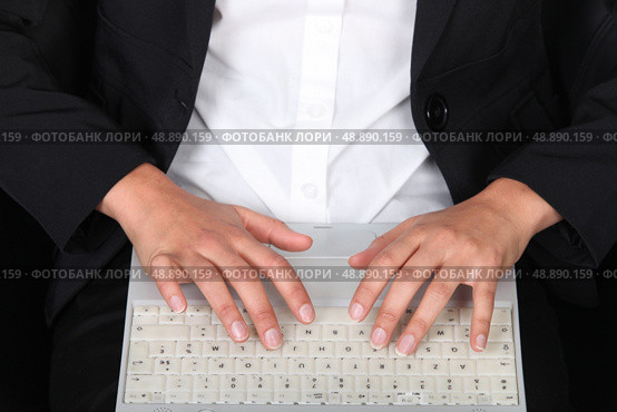Woman typing on laptop keyboard. Стоковое фото, агентство Ingram Publishing / Фотобанк Лори