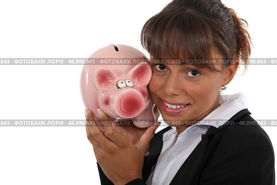 Woman with a piggy bank in hand. Стоковое фото, агентство Ingram Publishing / Фотобанк Лори