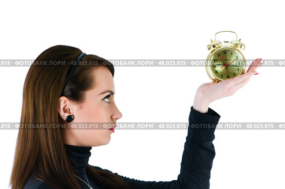Woman with clock isolated on the white. Стоковое фото, агентство Ingram Publishing / Фотобанк Лори