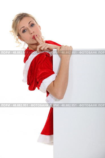 Woman with her finger on her lips. Стоковое фото, агентство Ingram Publishing / Фотобанк Лори