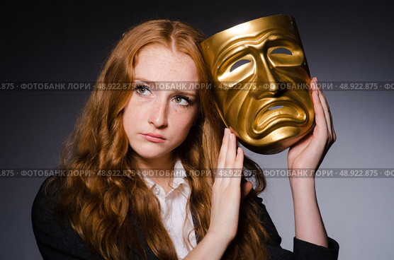 Woman with mask in hypocrisy concept. Стоковое фото, агентство Ingram Publishing / Фотобанк Лори