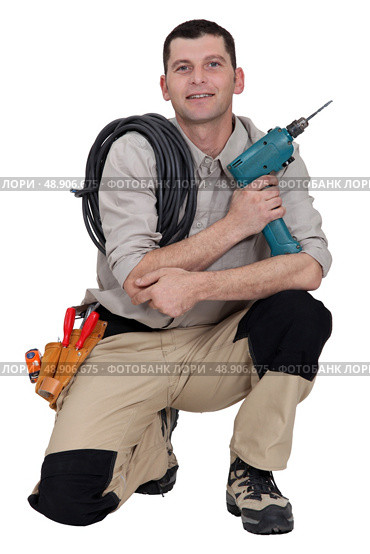 Woodworker crouching on white background. Стоковое фото, агентство Ingram Publishing / Фотобанк Лори
