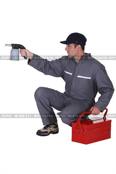 Workman with a blowtorch. Стоковое фото, агентство Ingram Publishing / Фотобанк Лори