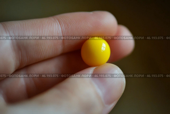 Yellow ball balanced on a fingertip against a dark background during daylight. Стоковое AI-изображение, AI-художник Юлия Гапеенко / Фотобанк Лори