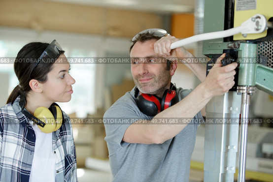 young attractive student of mechatronics working on project. Стоковое фото, агентство Ingram Publishing / Фотобанк Лори